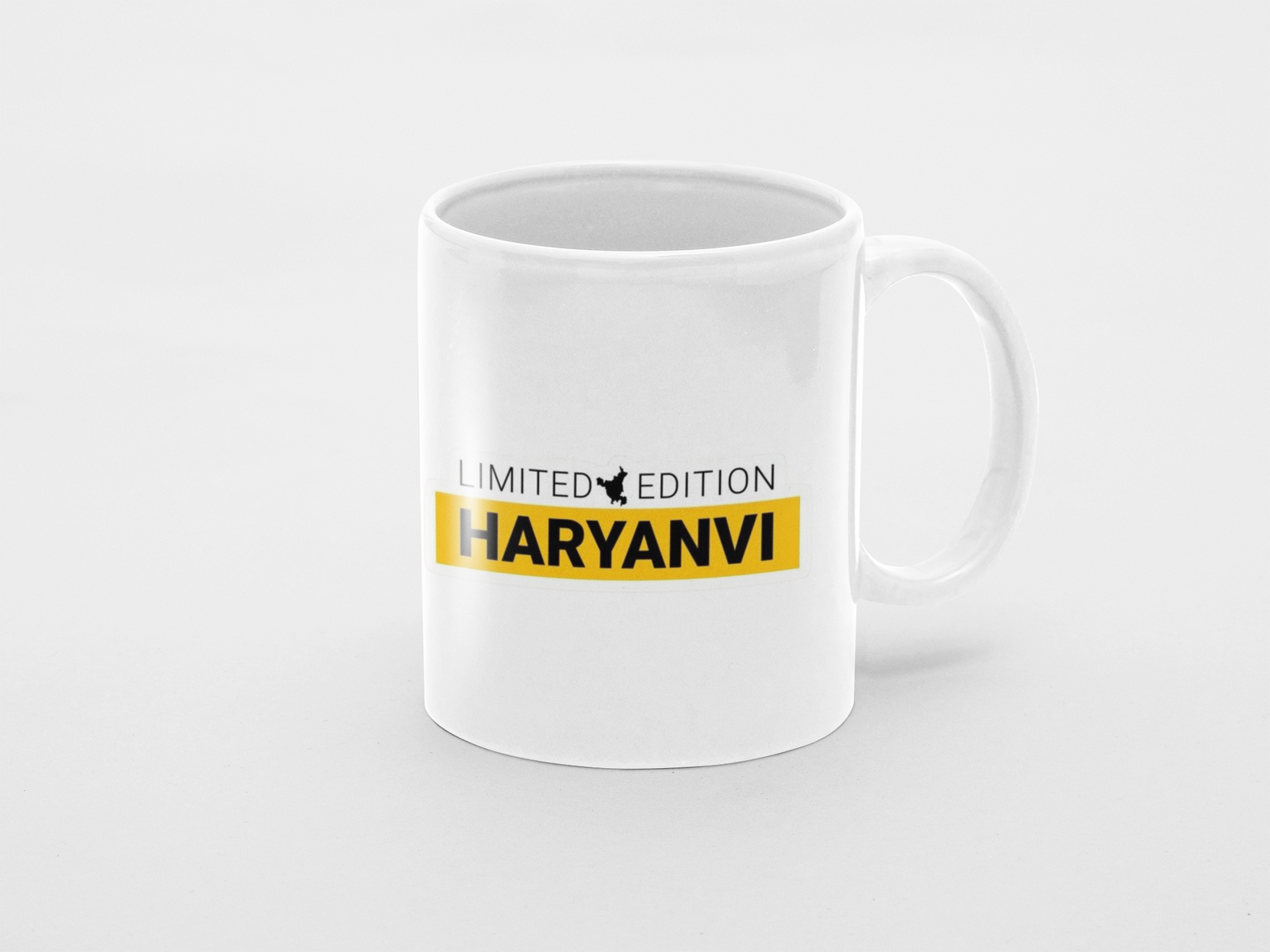 white coffee mug featuring "Limited Edition Haryanvi" print.