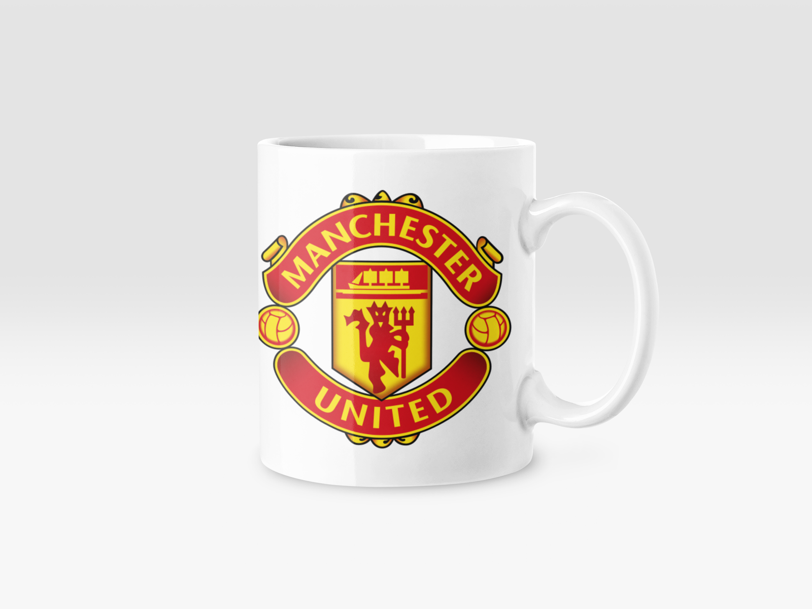 White Coffee Mug featuring the red Manchester United logo