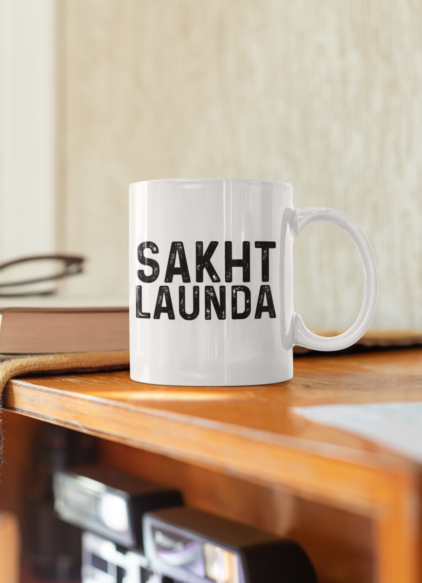 white coffee mug featuring bold "Sakth Launda