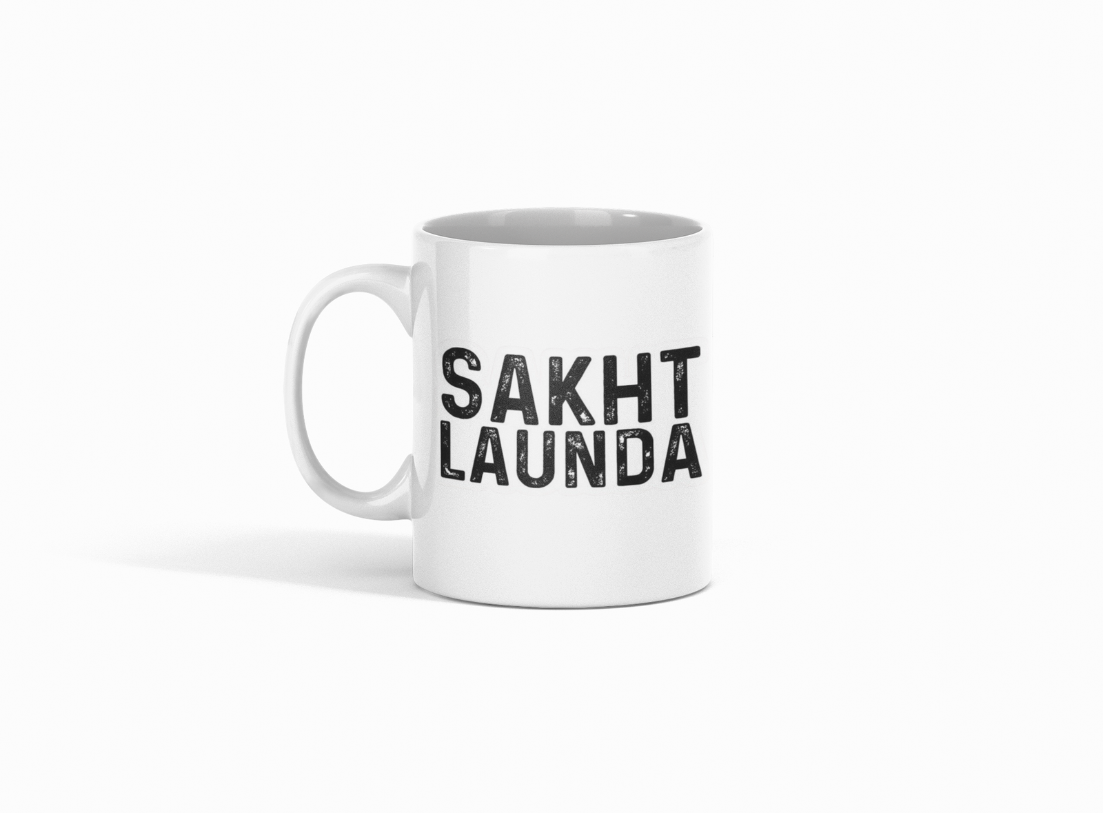 white coffee mug featuring bold "Sakth Launda