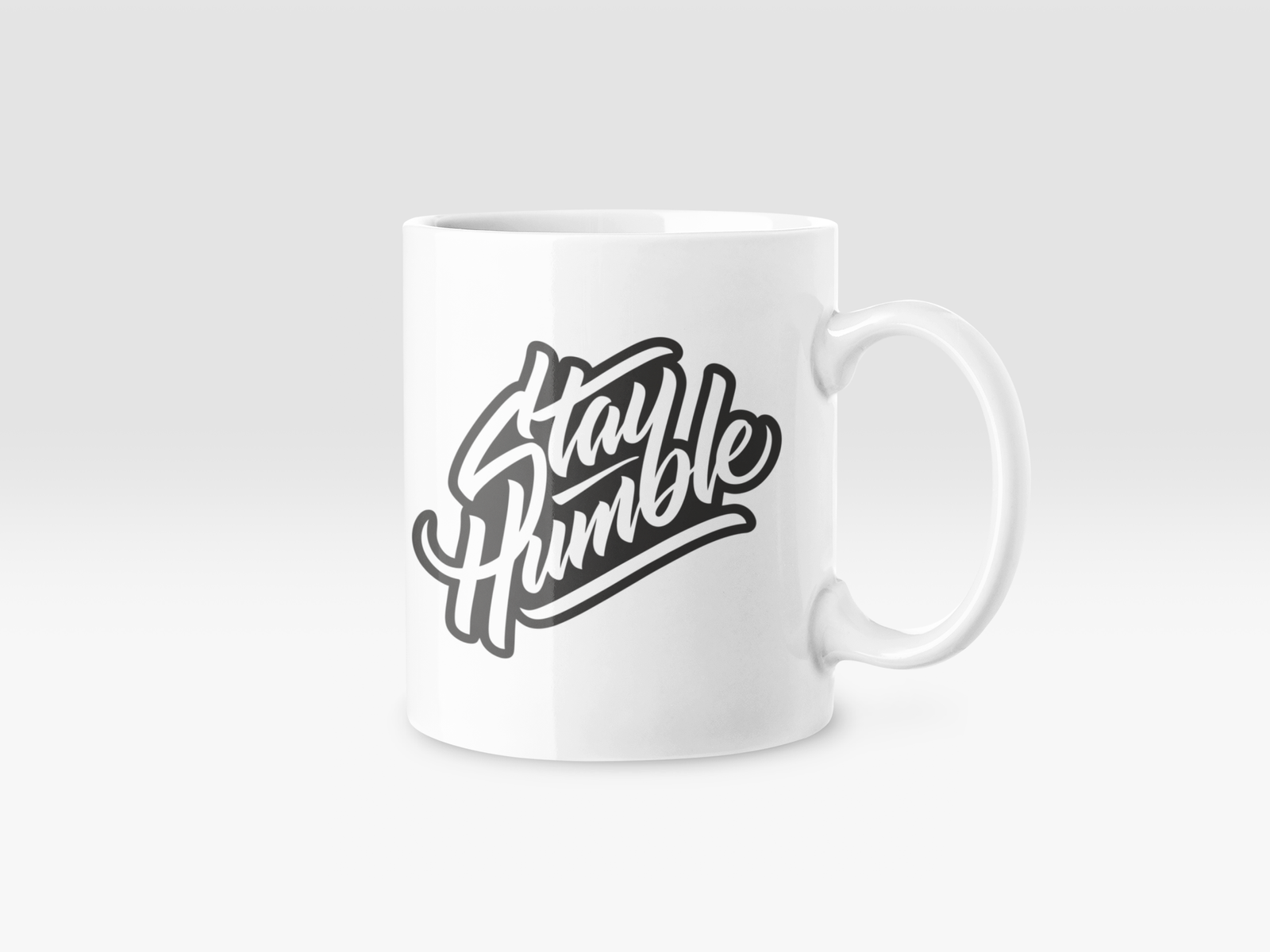 Premium White Coffee Mug featuring "Stay Humble" italic text.